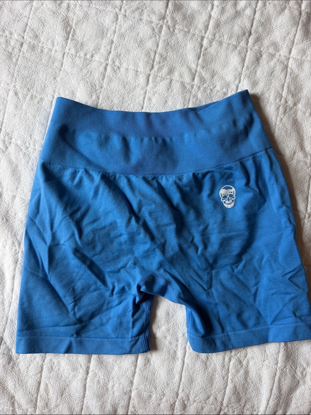 High-Rise Blue Womenâs Bike Shorts with Subtle Skull Detail